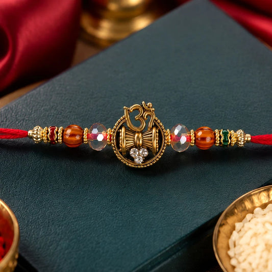 Devotional Rakhi Om Damru Trishul Design with Sparkling Stones
